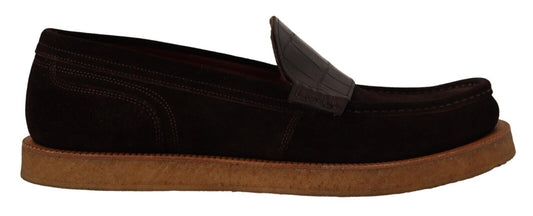 Pair of black sandals with brown soles and straps