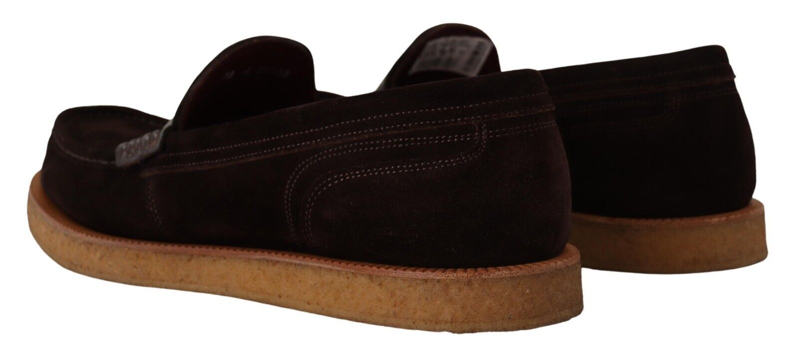 Pair of brown suede shoes with tan soles and laces