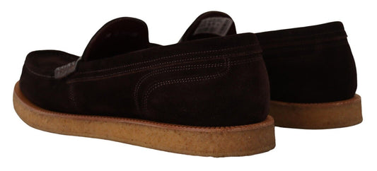 Pair of brown suede shoes with tan soles and laces