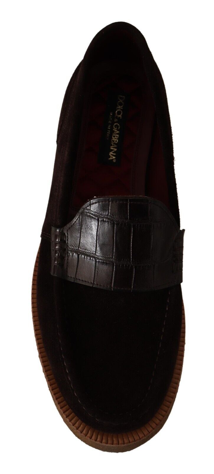 Brown shoe with strap across top and heel