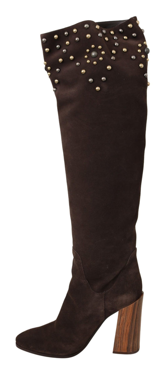 Brown knee high boot with heel and embellishments on side