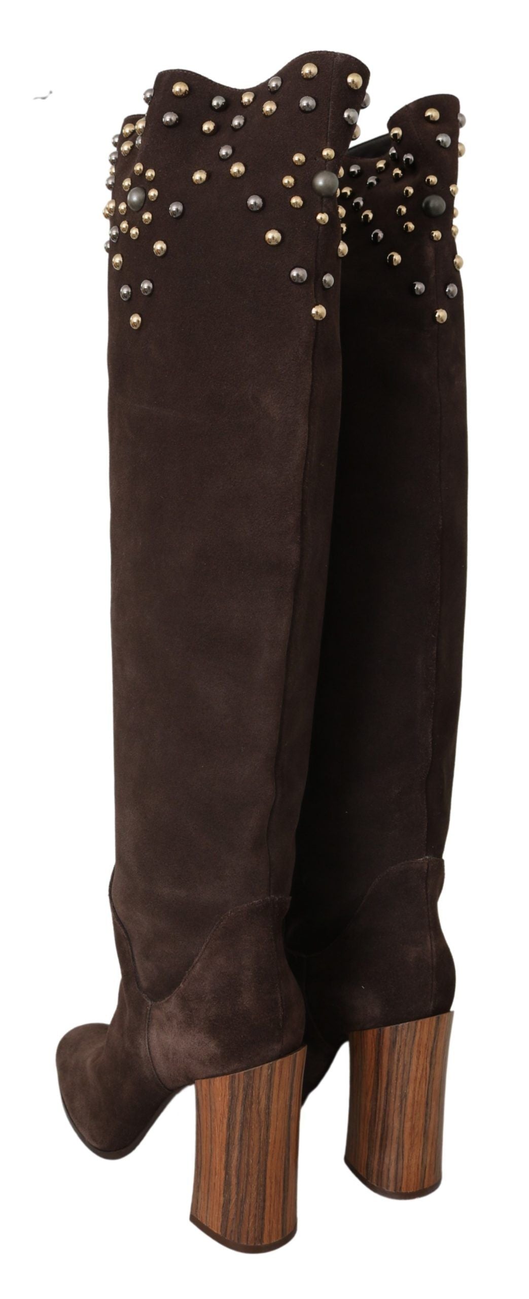 Pair of knee high boots with heels and embellishments