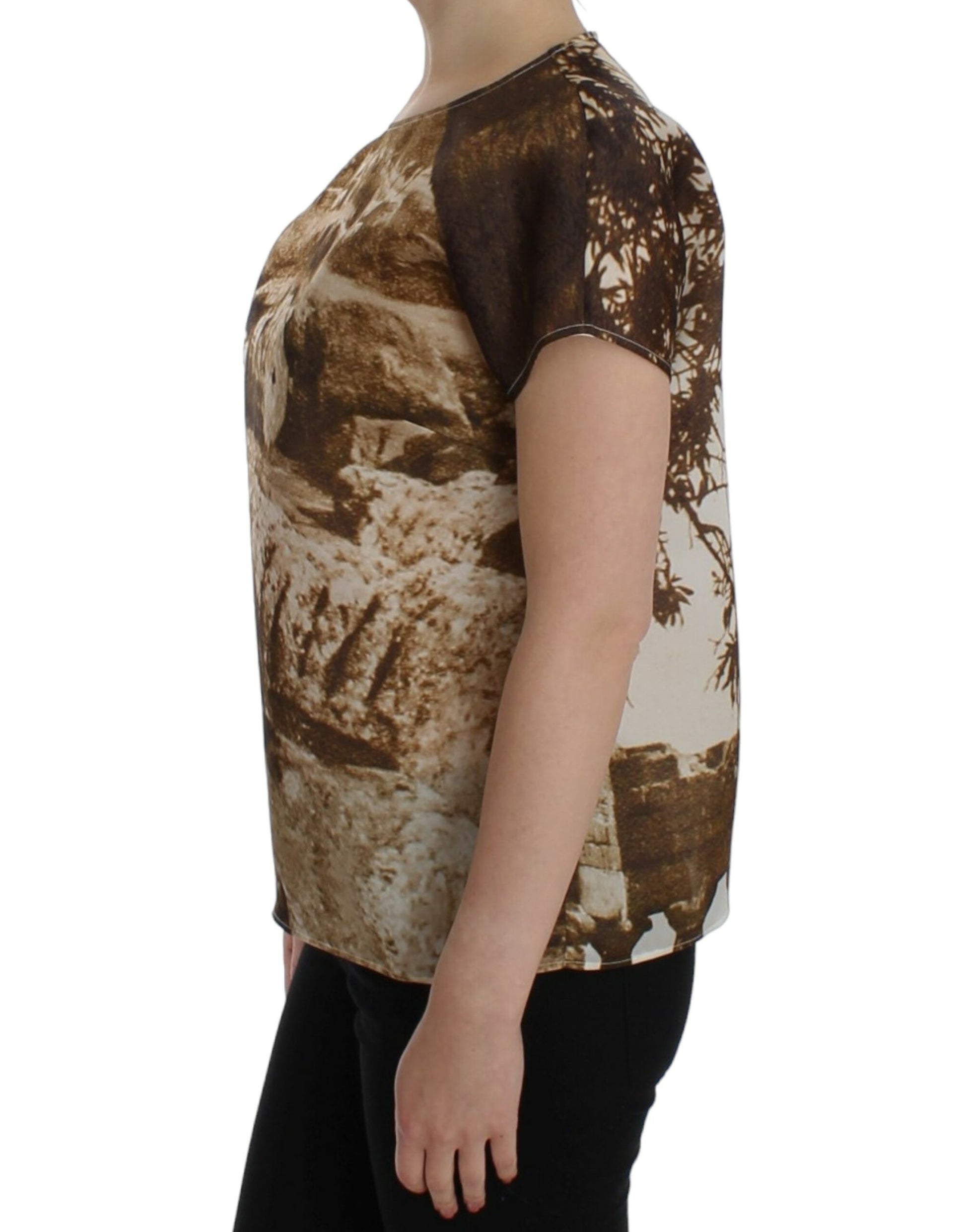 Woman wearing a short sleeved shirt with a camouflage pattern