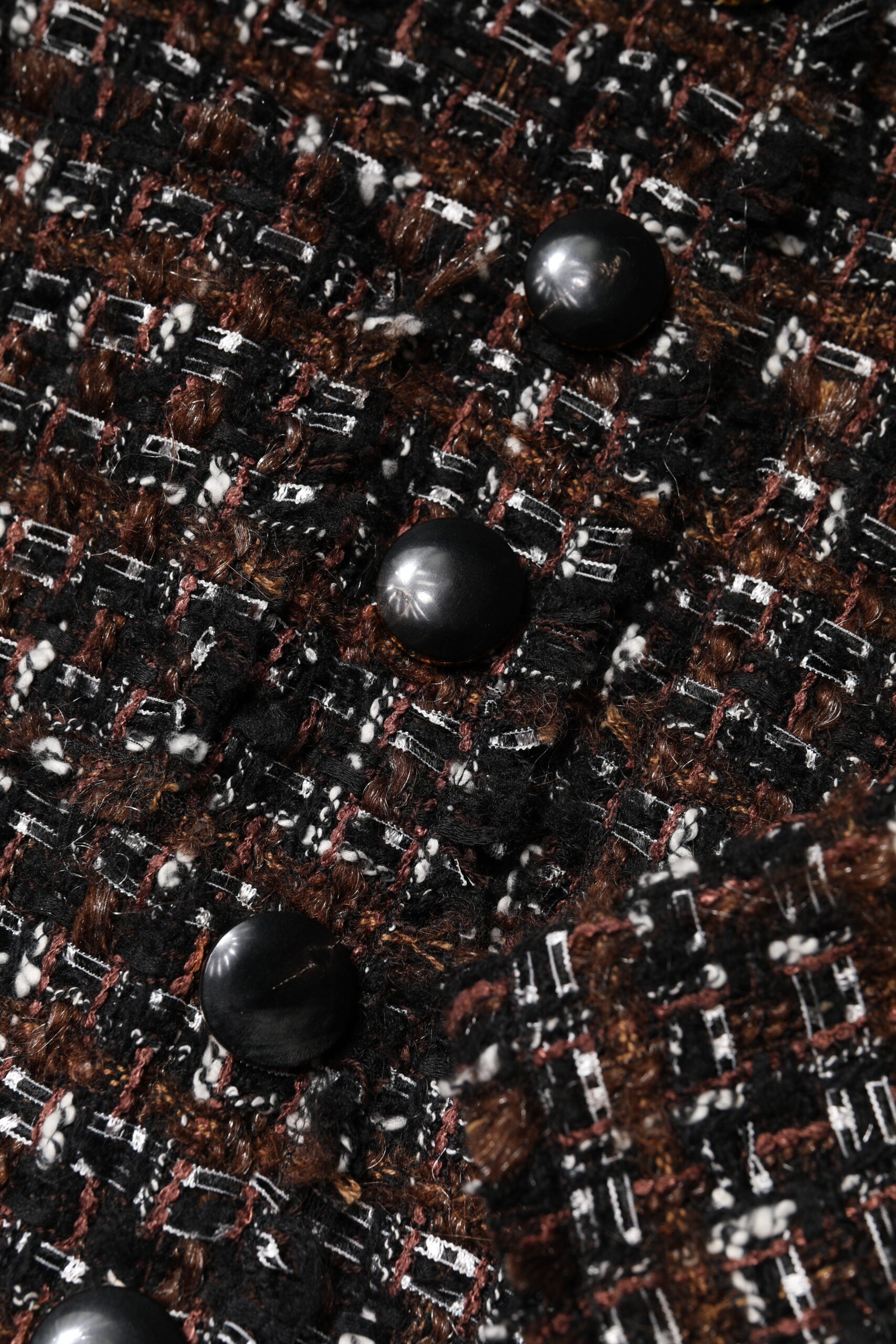 Black beads on fabric background