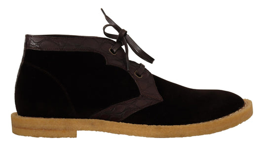 Pair of black suede boots with wooden soles and laces
