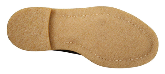 Two brown cookies shaped like feet with a hole in the center