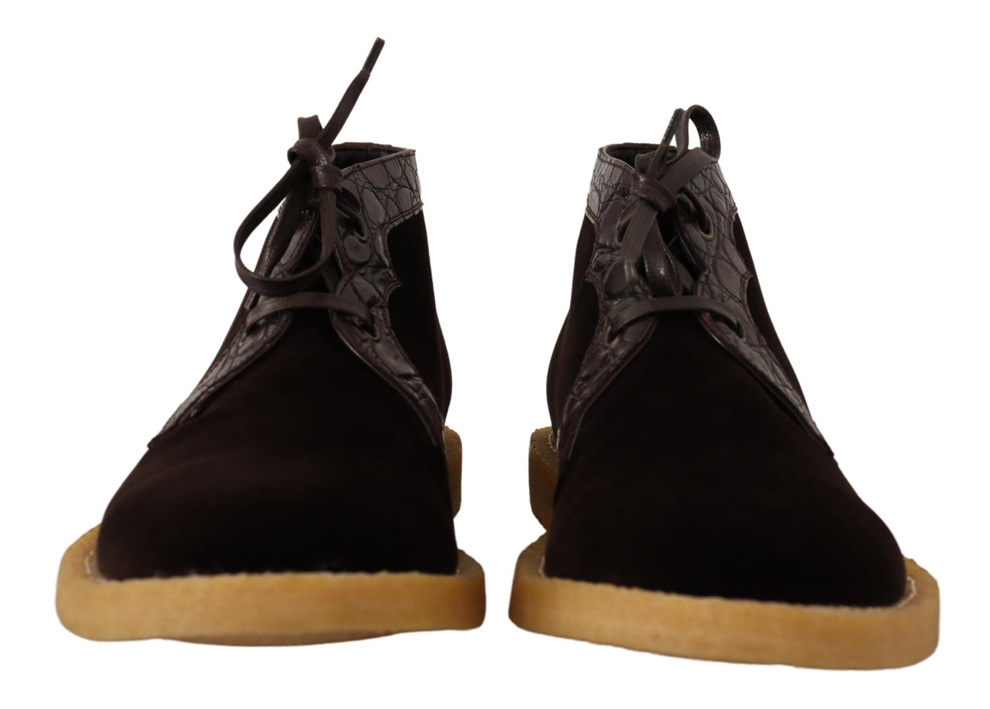 Pair of black suede boots with tan soles and laces