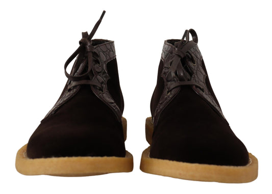 Pair of black suede boots with tan soles and laces