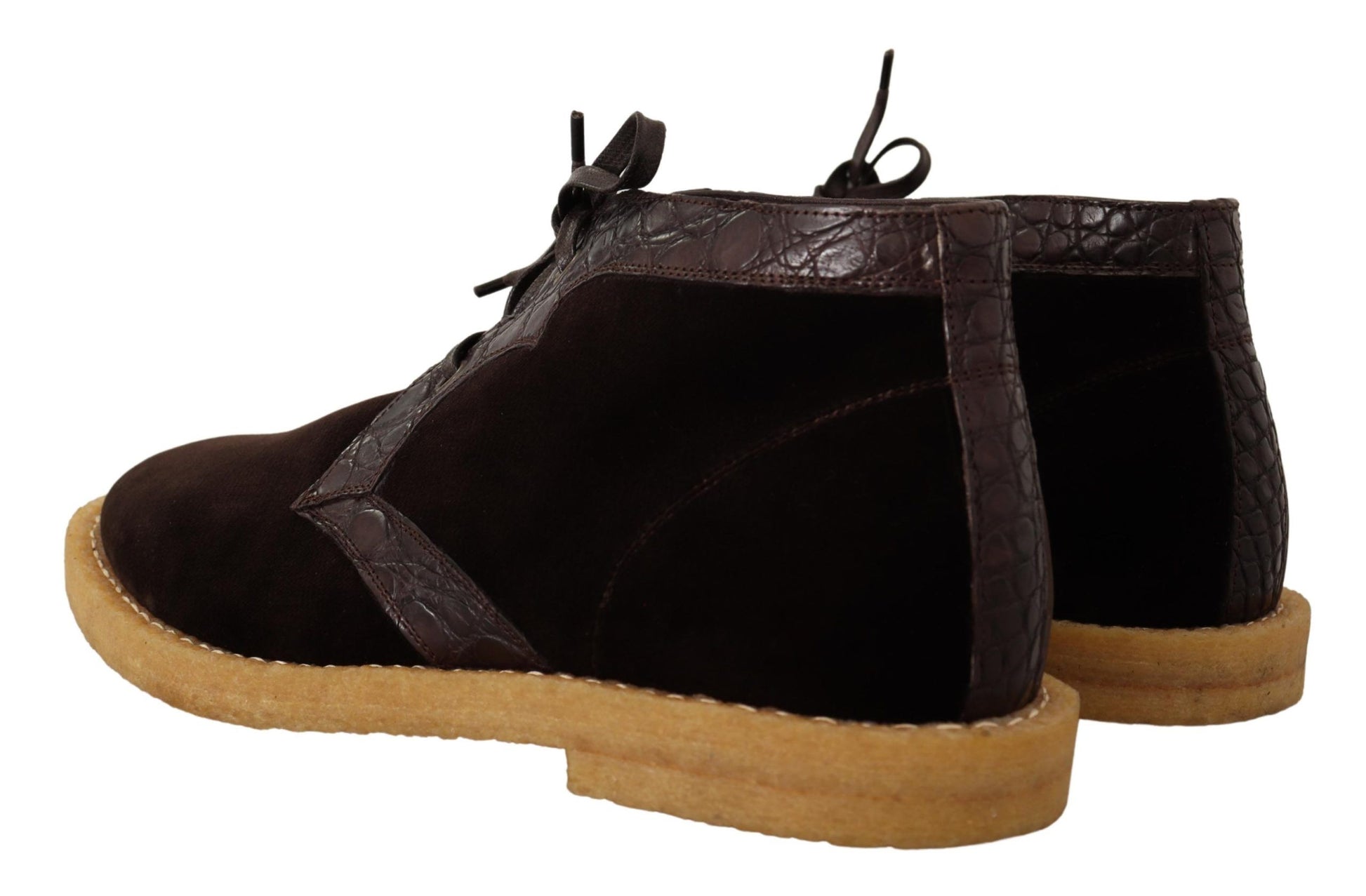 Pair of brown suede boots with laces and a heel