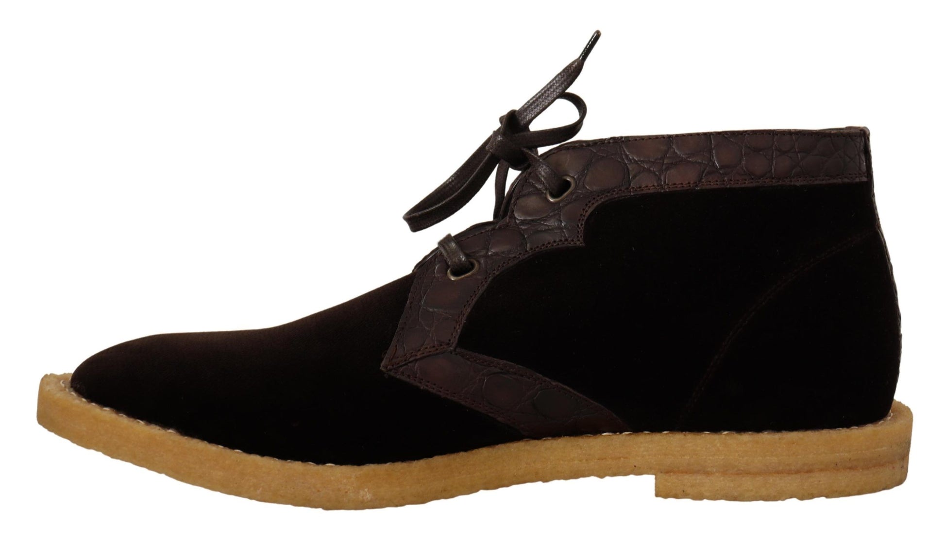 Pair of black suede boots with brown soles and laces