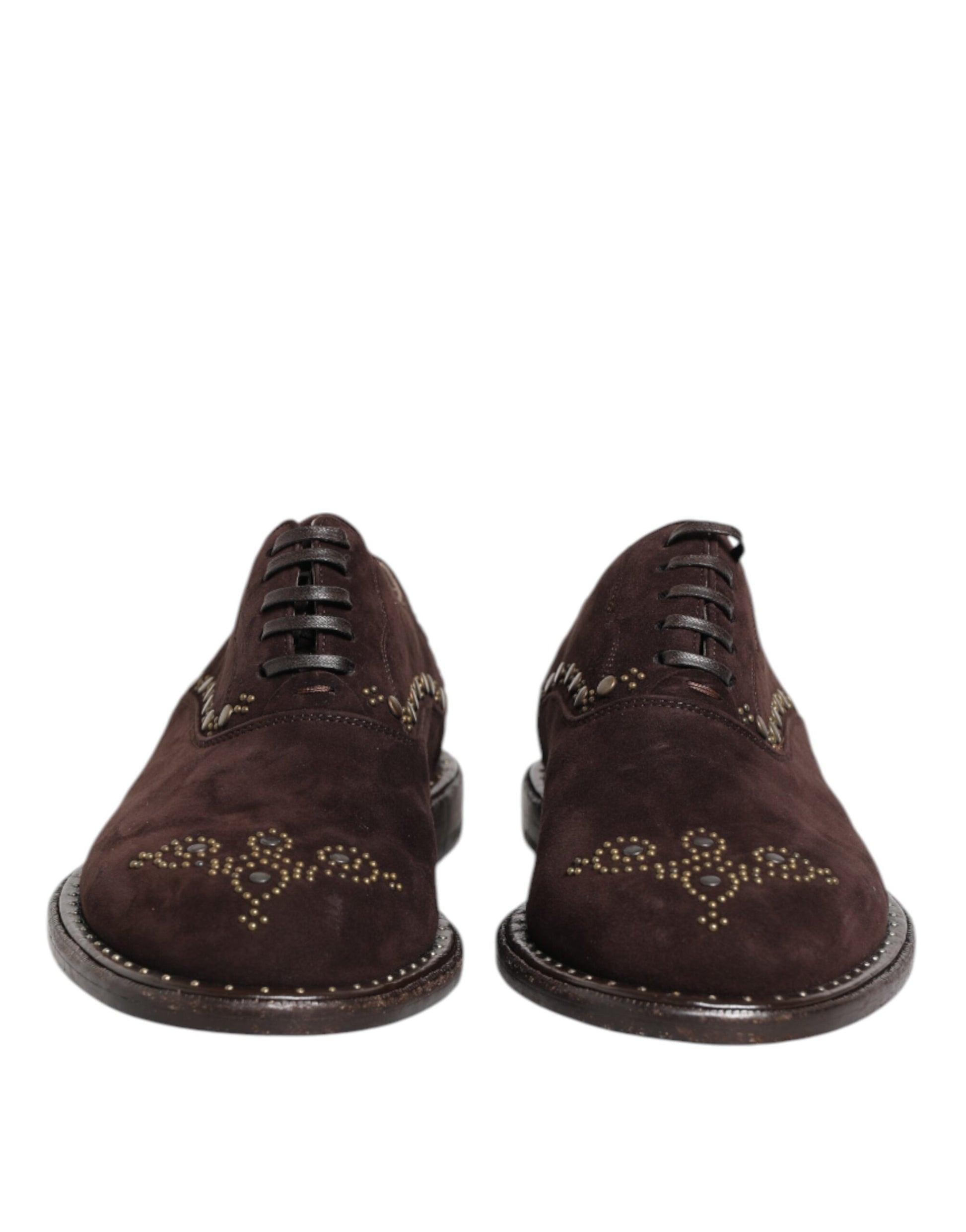 Pair of brown velvet lace up dress shoes with gold embroidery and black soles