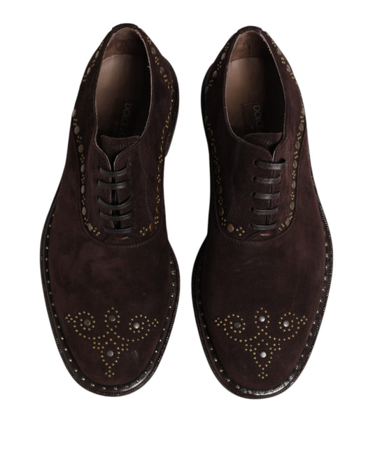 Pair of brown velvet lace up dress shoes with gold accents and embroidery