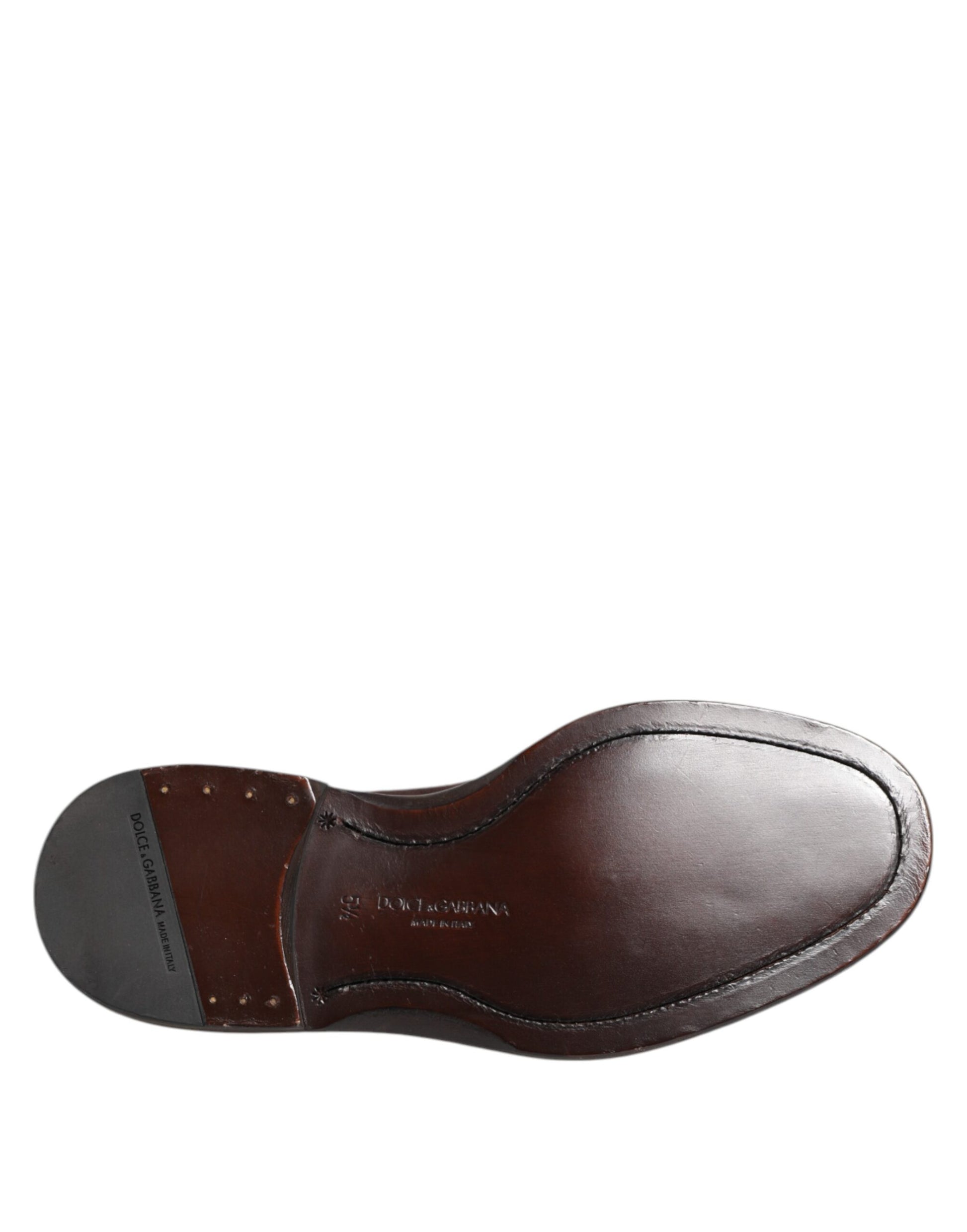 A single brown velvet lace up oxford dress shoe with a visible logo on the side