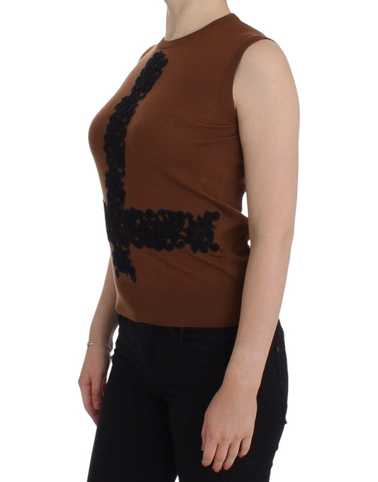 Woman wearing brown top with black embellishments