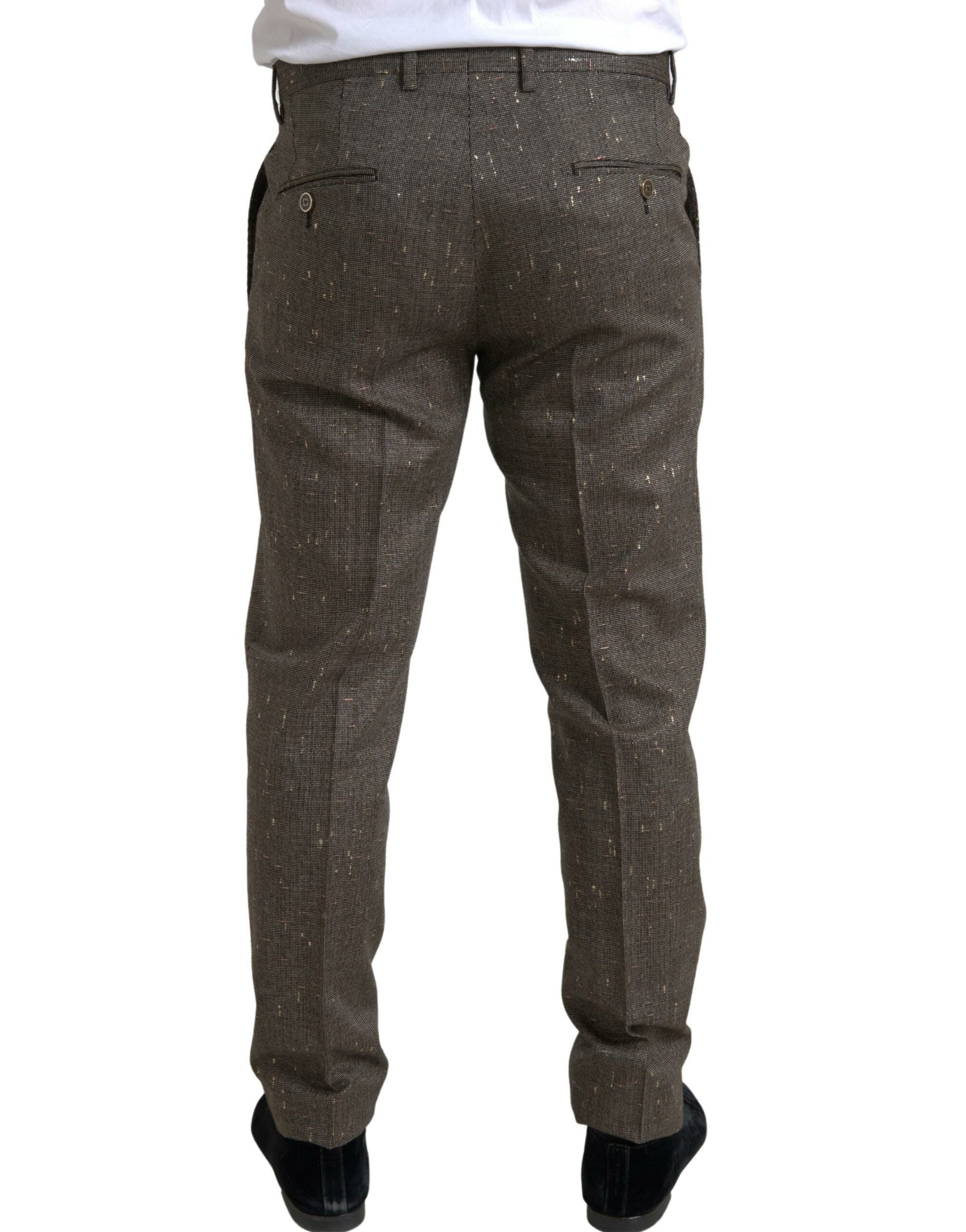 A pair of brown wool dress pants with a skinny fit, featuring a button and zipper closure
