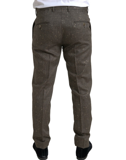 A pair of brown wool dress pants with a skinny fit, featuring a button and zipper closure