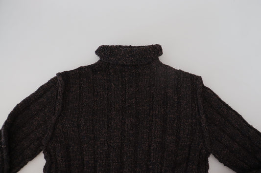 Dark knit sweater on white surface