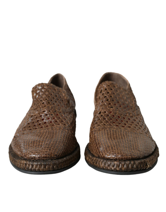 Pair of brown leather shoes with a patterned design on the upper part