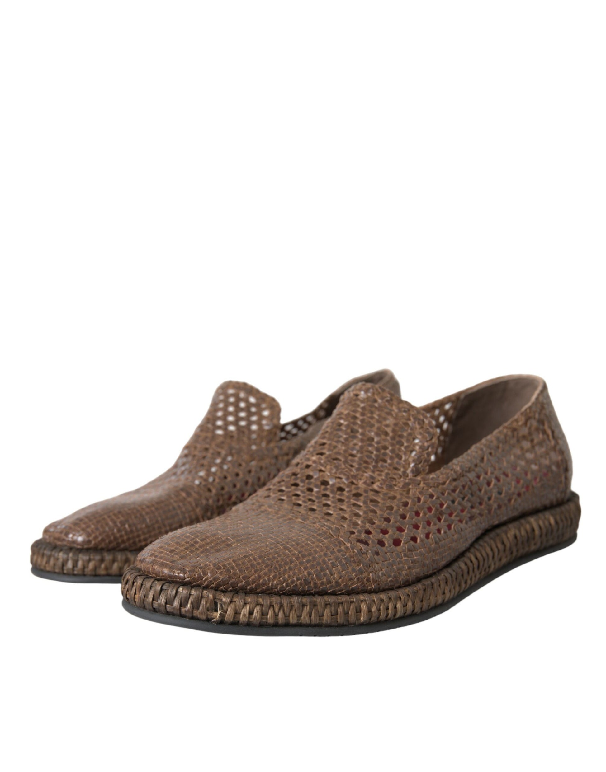 Pair of brown wedge shoes with a textured surface and a patterned sole