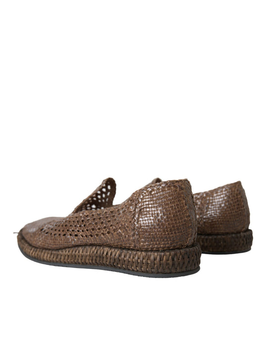 Pair of brown woven shoes with black soles and laces