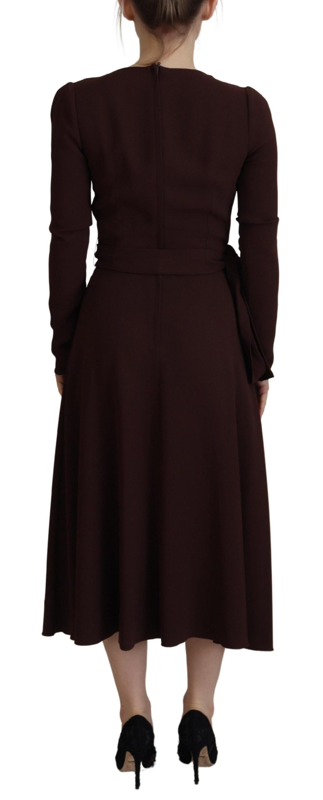 A long sleeved midi dress with wrap style and stretch fabric