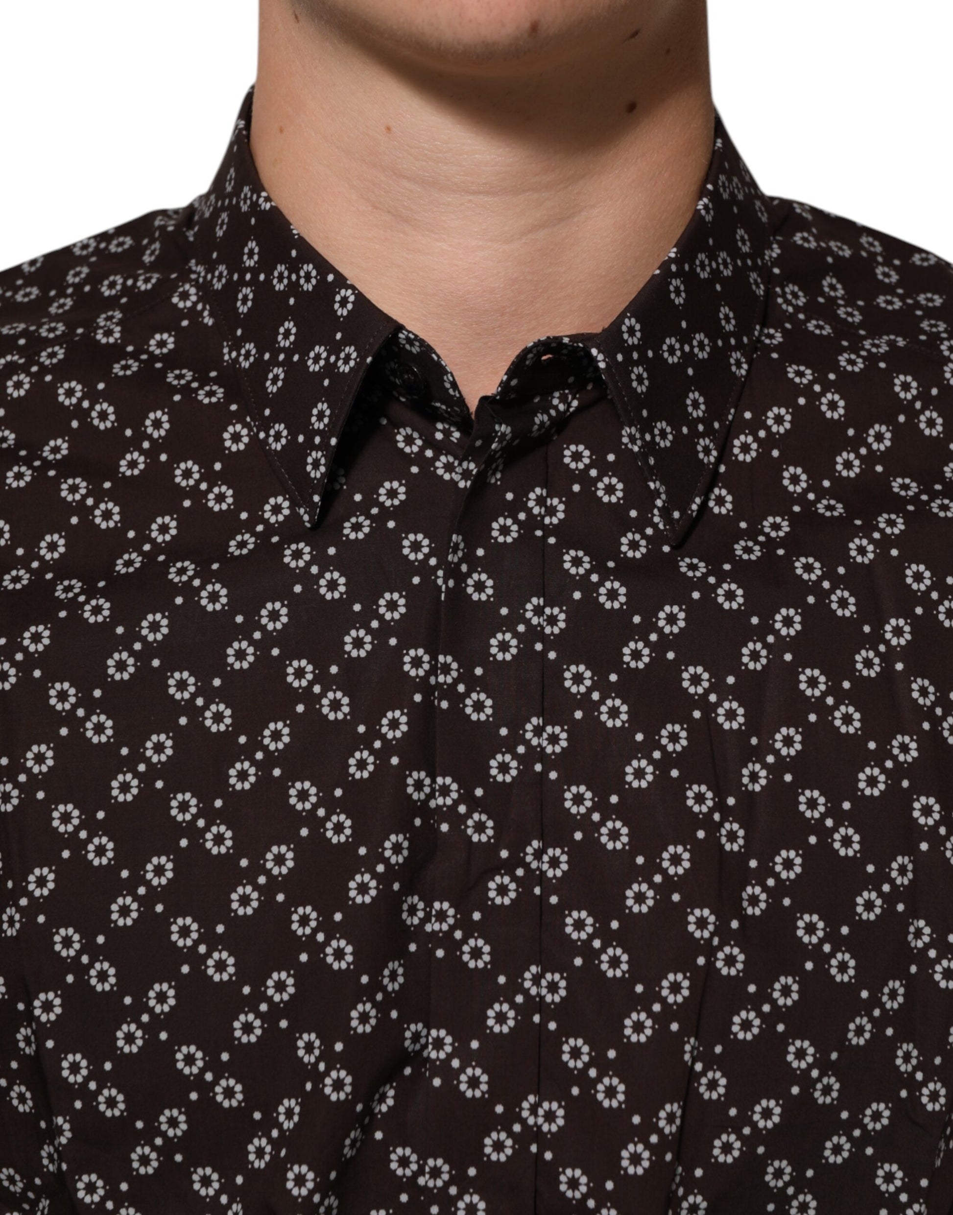 A black shirt with a floral pattern on the collar and sleeves
