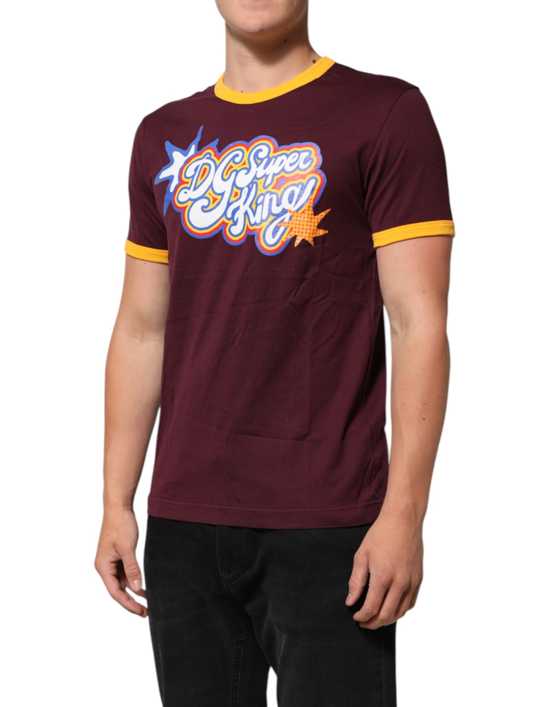 Man wearing maroon t-shirt with yellow trim and graphic design