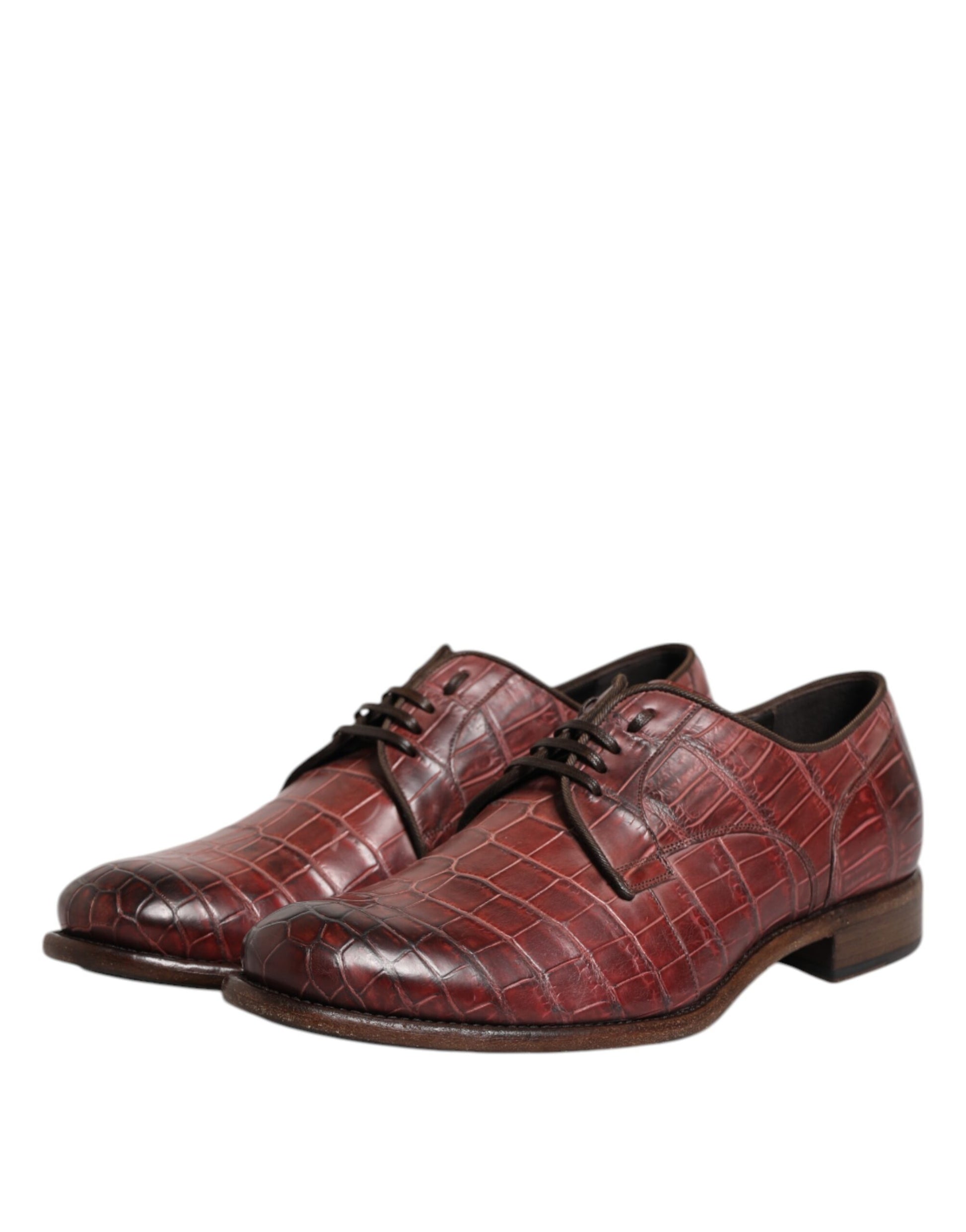 Red leather lace-up shoes with a burgundy hue, featuring a classic derby design