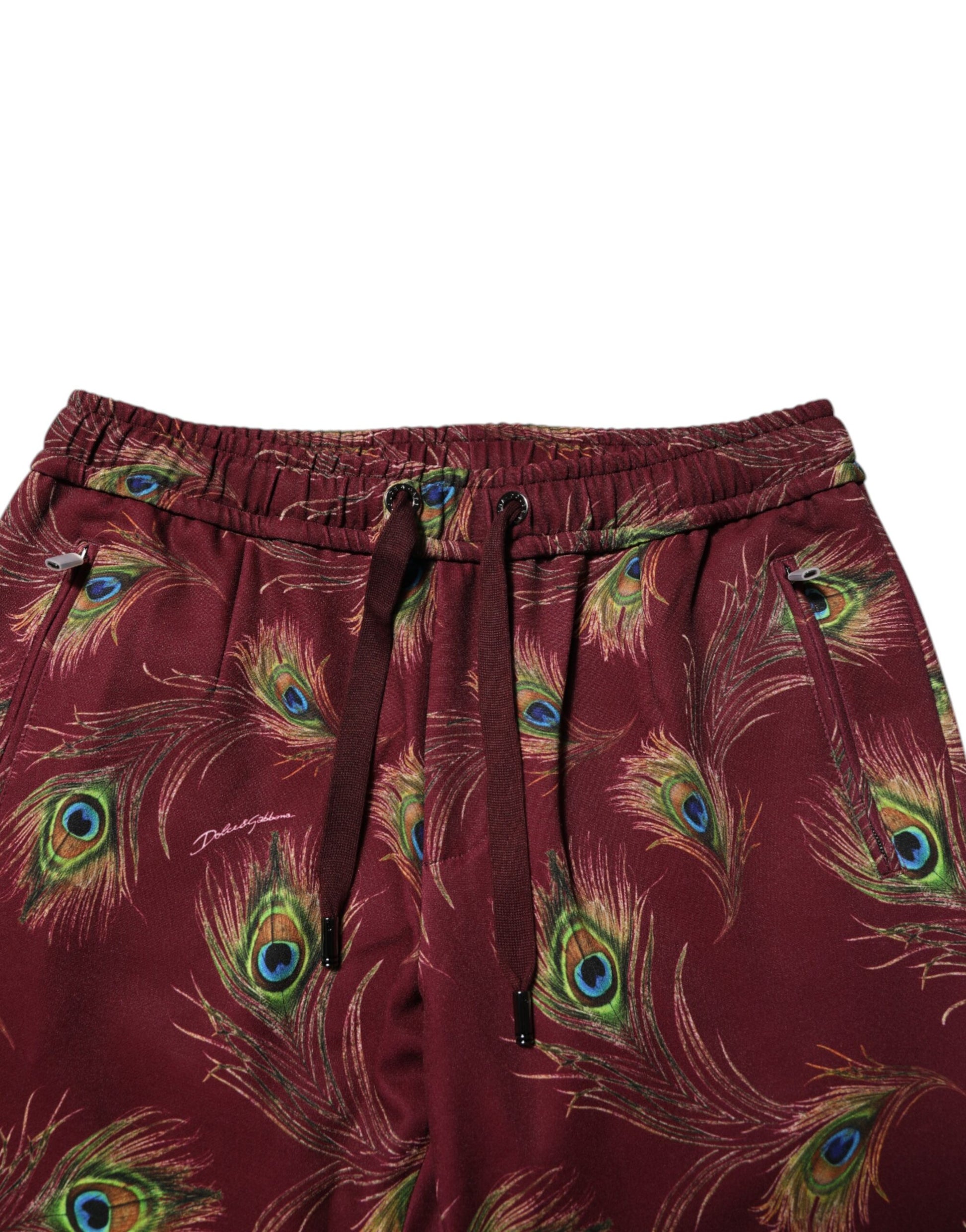Pair of red pajama shorts with peacock feather pattern