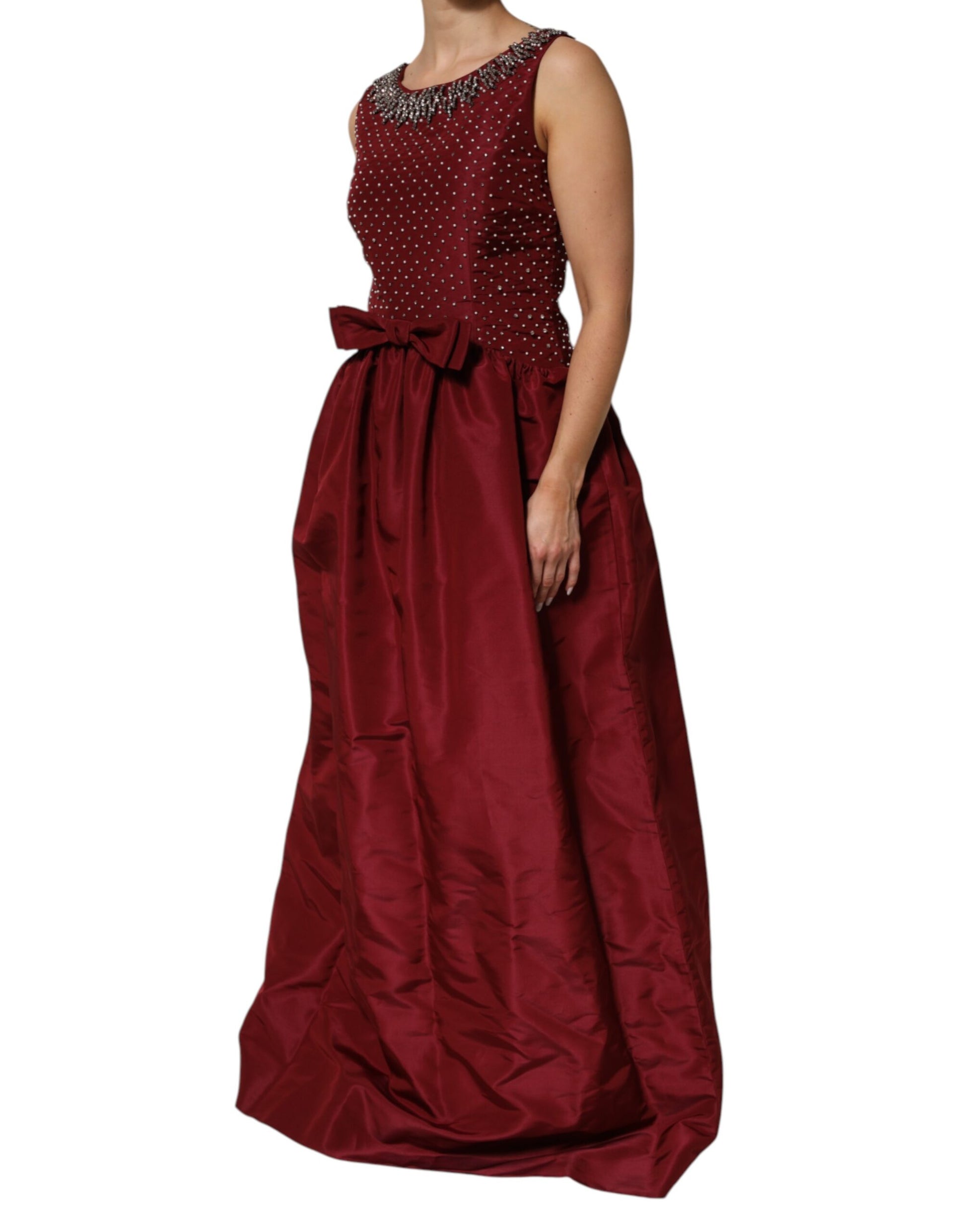 A long burgundy silk evening gown with beaded bodice and skirt
