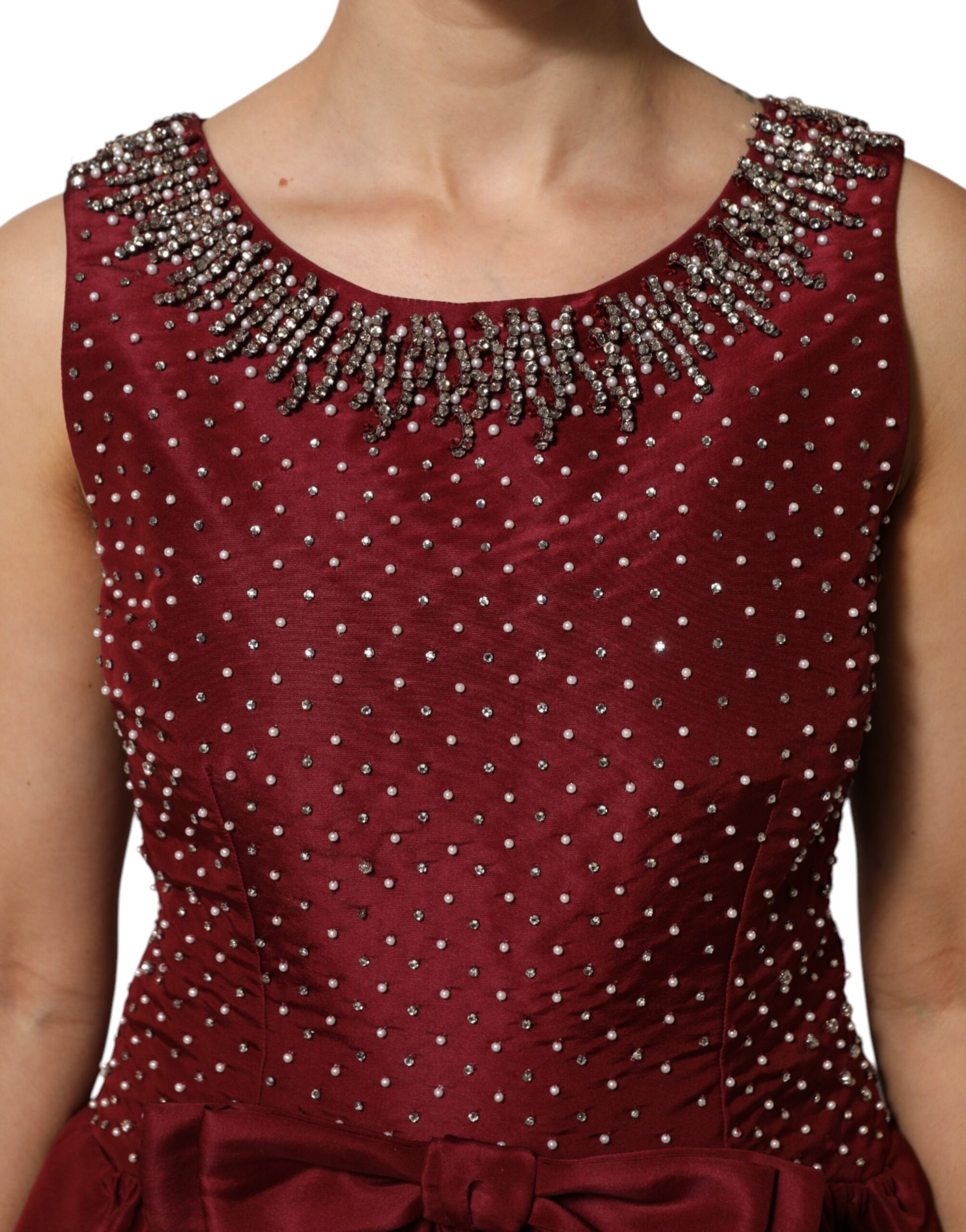 A burgundy silk evening gown with beaded neckline and bodice