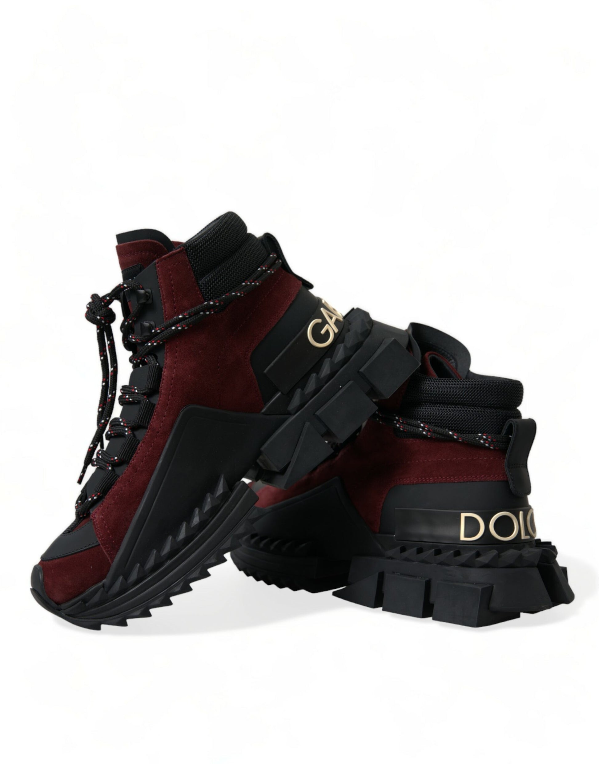Pair of red and black hiking boots with laces and buckles