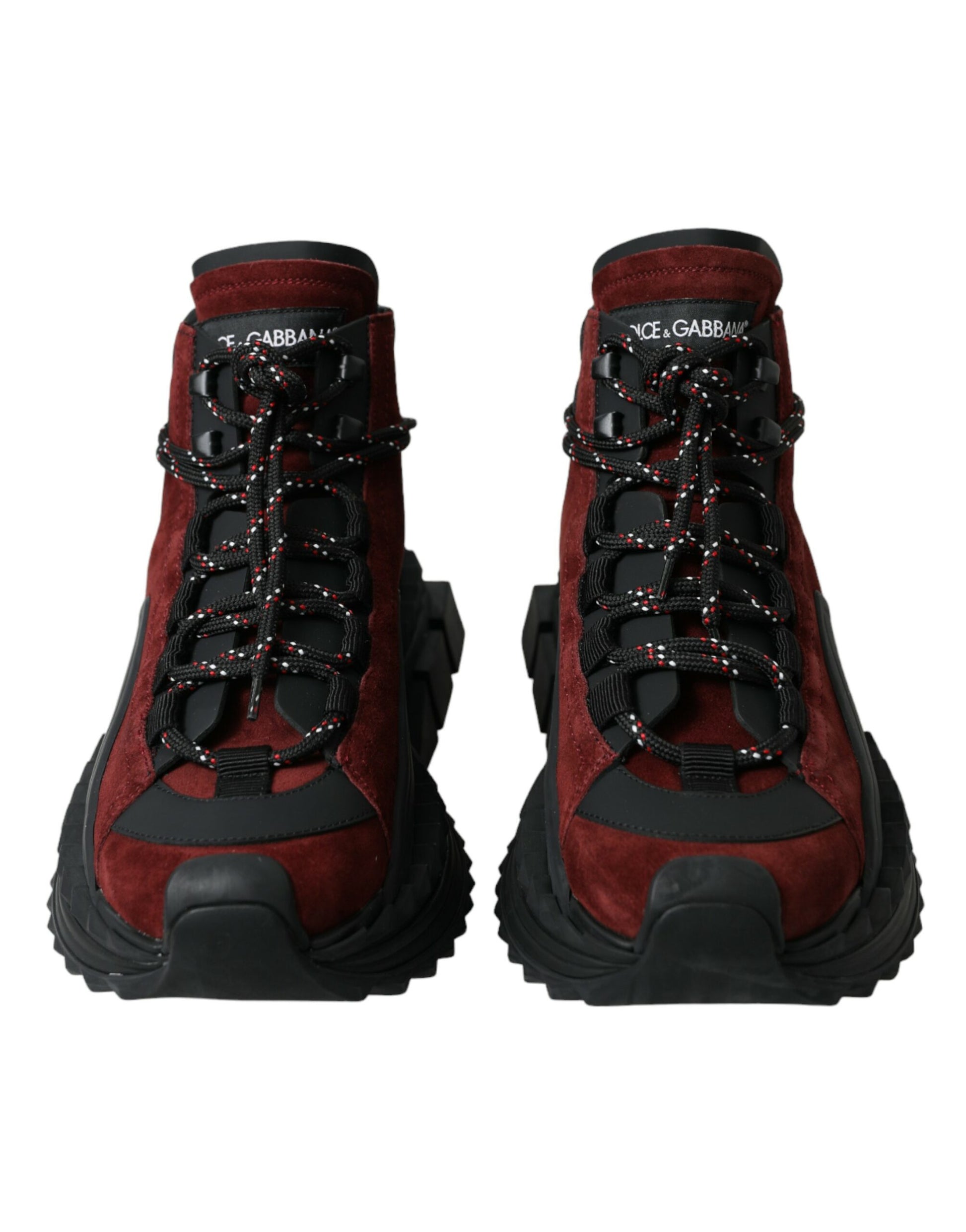 Pair of red hiking boots with laces and straps for secure fit