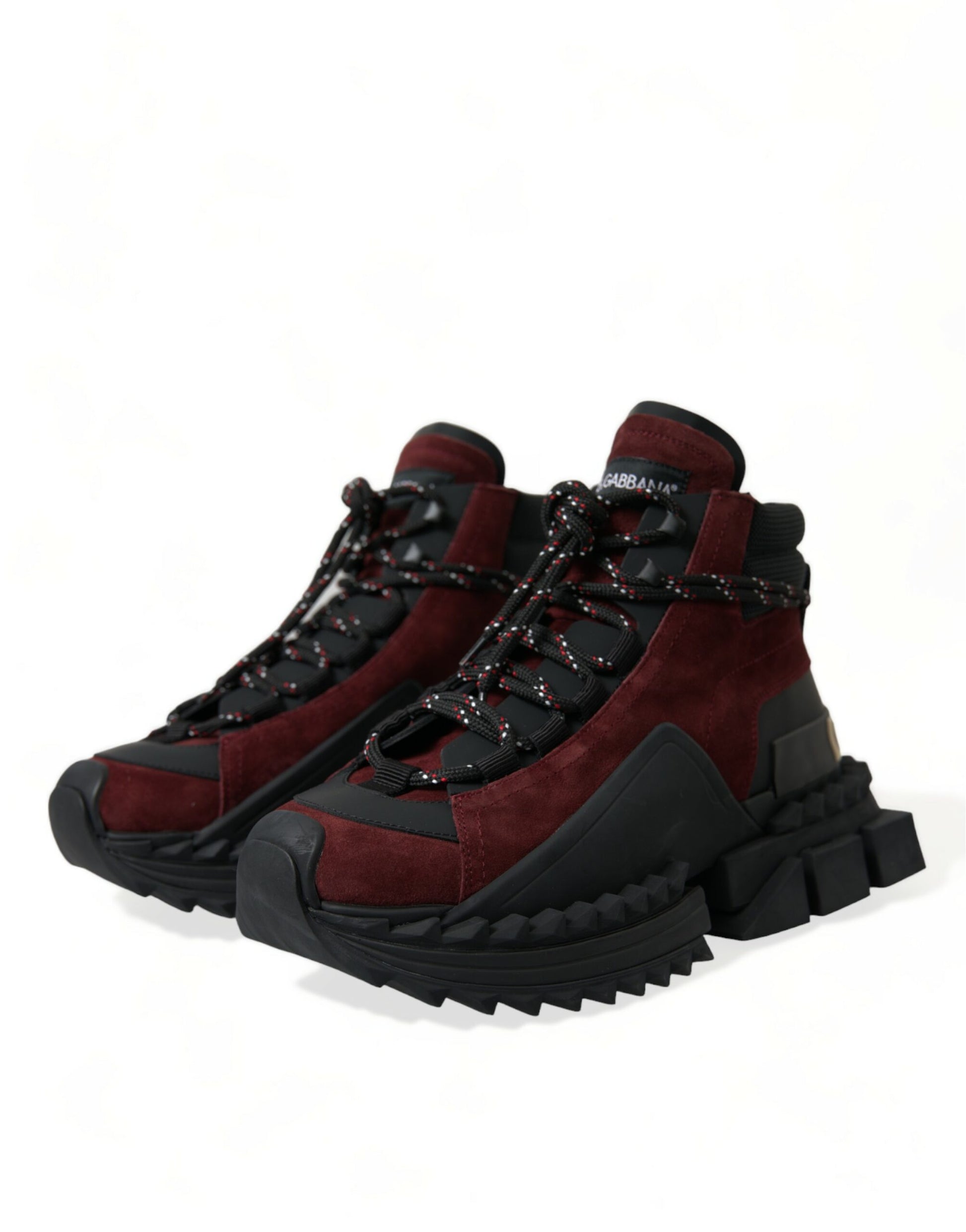 Pair of red hiking boots with black laces and white soles