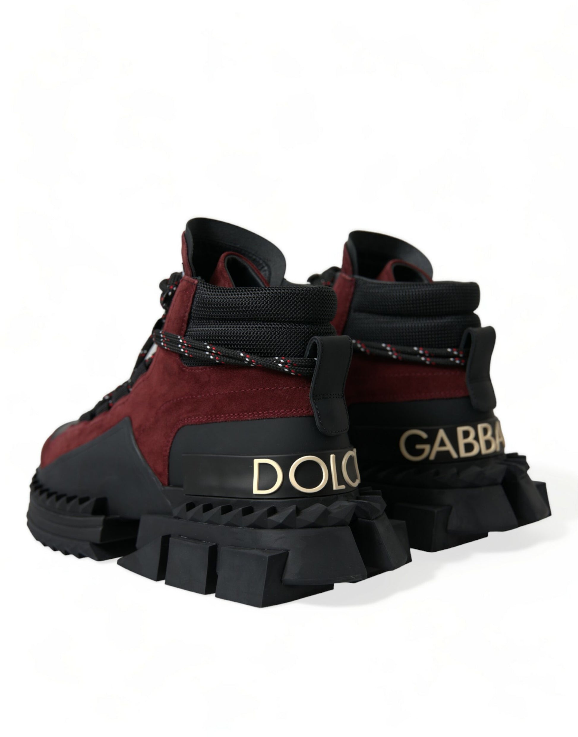 Pair of children's boots with a black and red color scheme