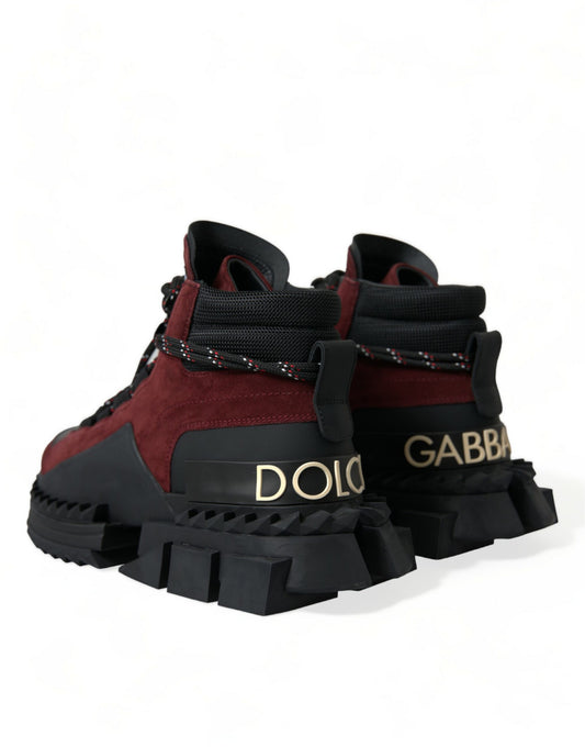 Pair of children's boots with a black and red color scheme