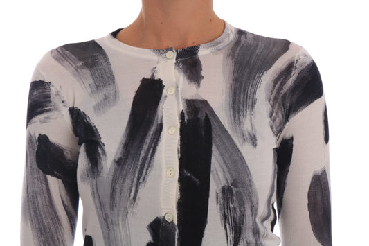 Black and white sweater with abstract design on torso