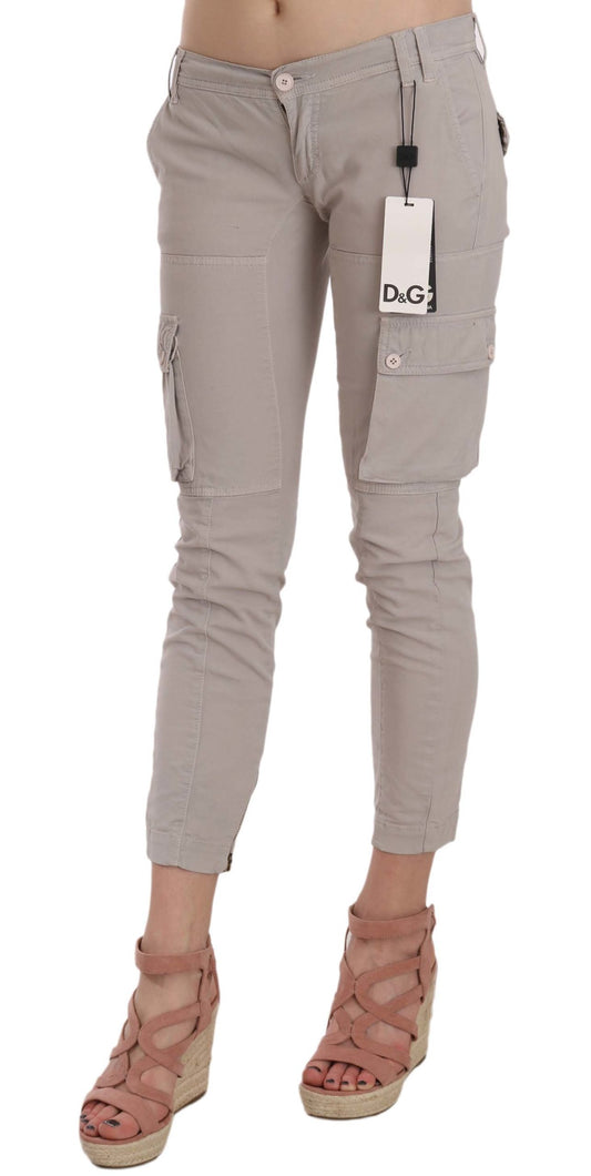 Pair of light grey distressed jeans with front pockets and zipper detailing