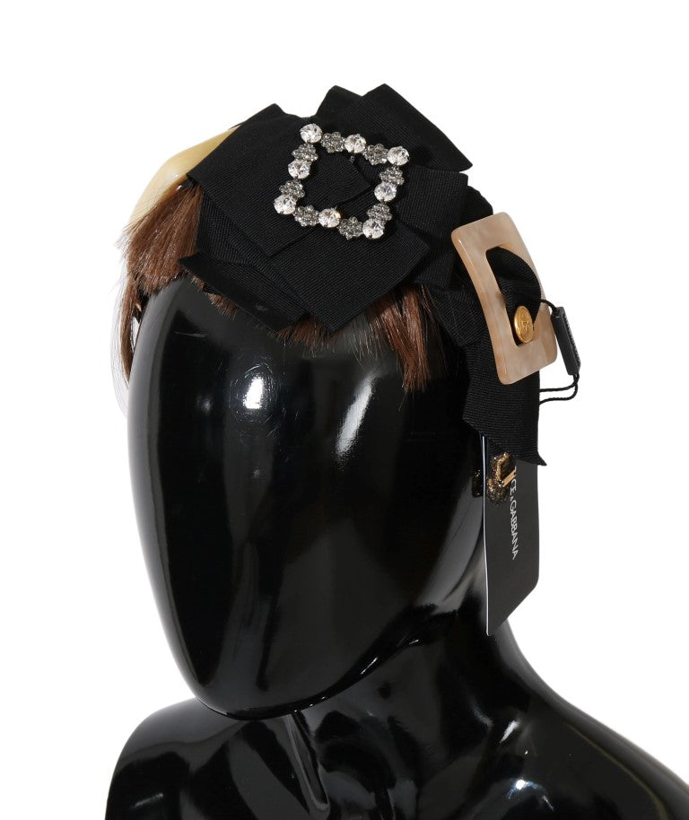 Headband with bow and rhinestones on black mannequin head