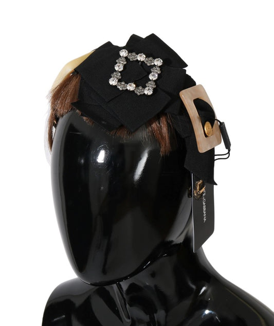 Headband with bow and rhinestones on black mannequin head