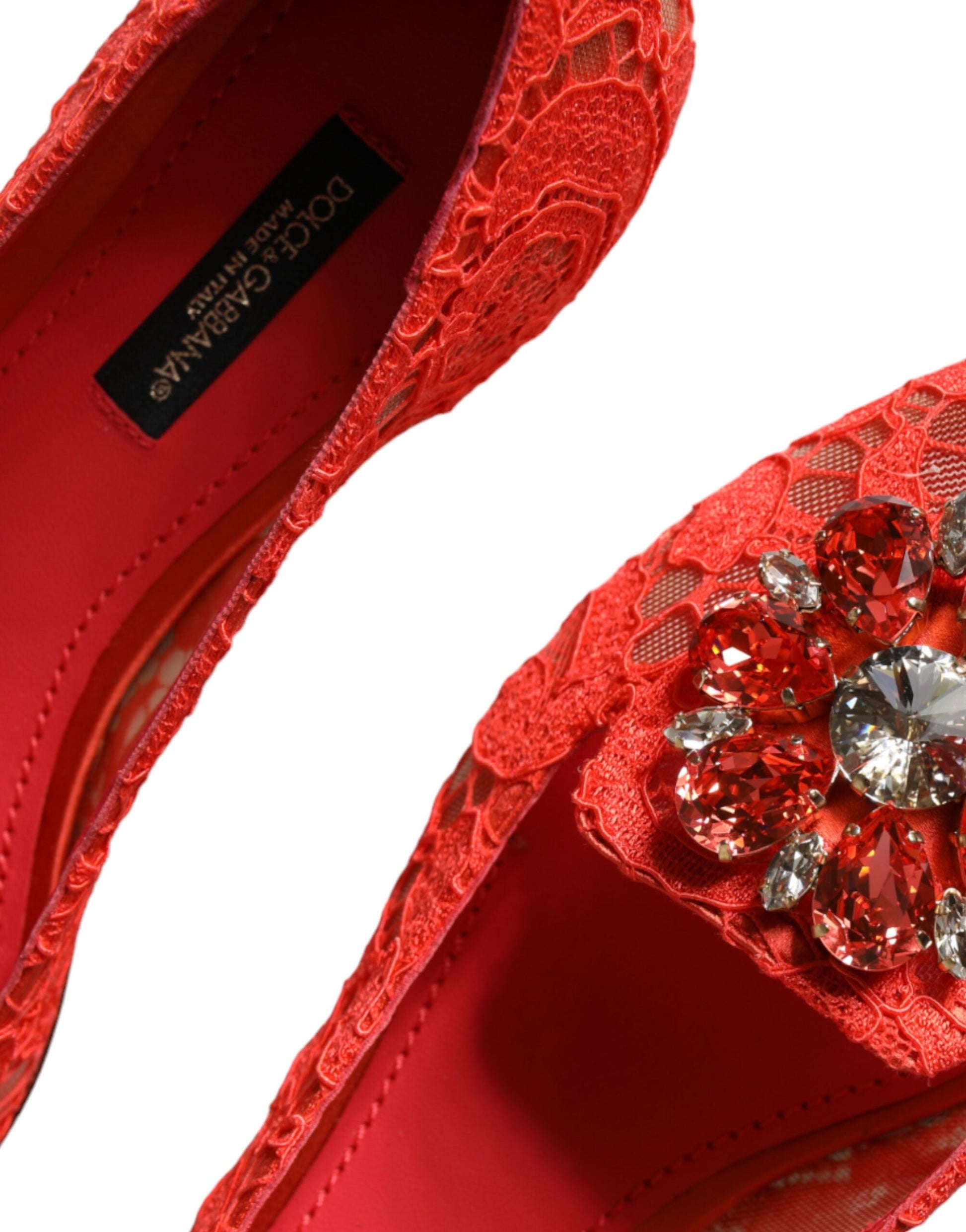 Red shoe with lace design and rhinestone embellishment