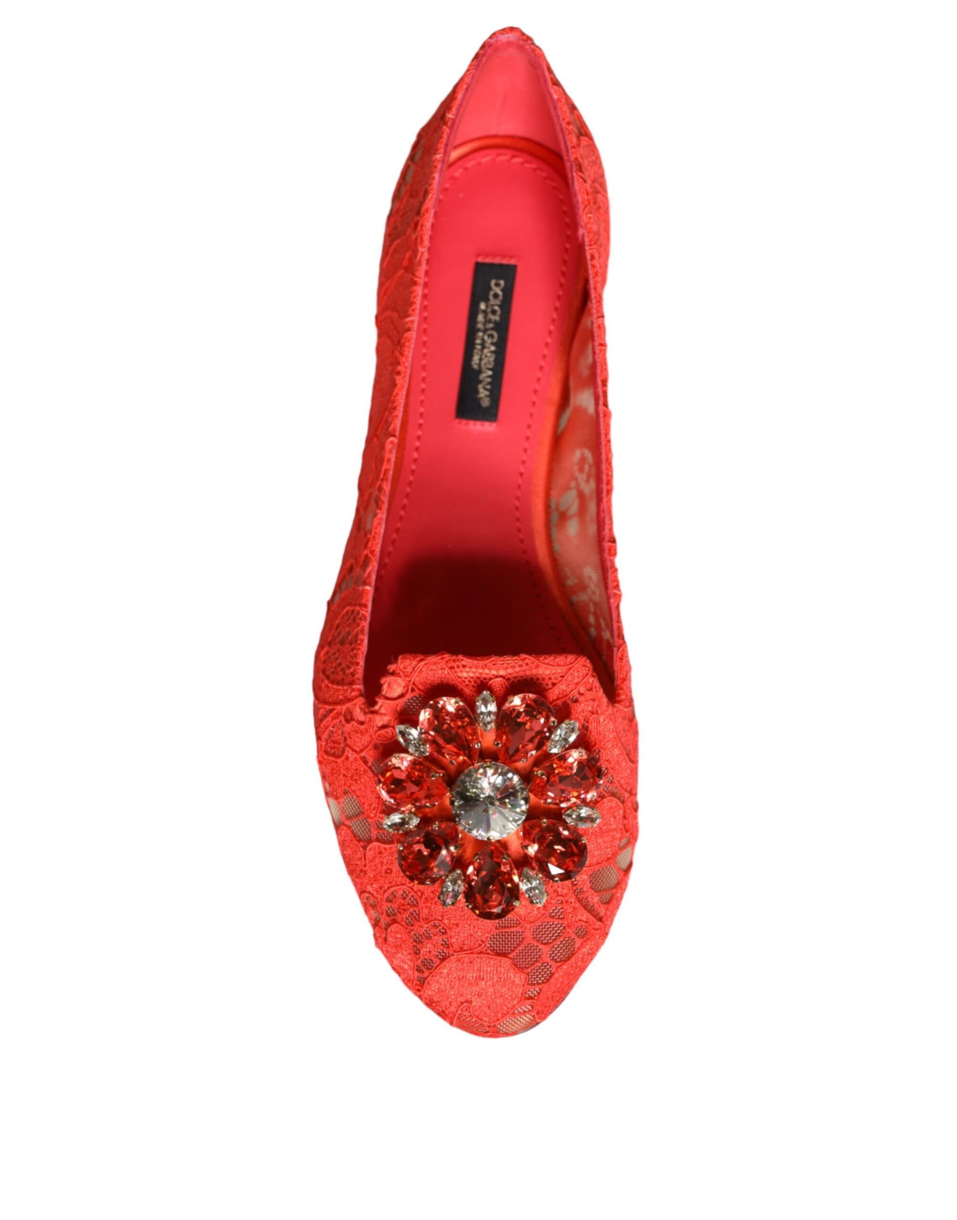 Red shoe with sparkling embellishments on toe