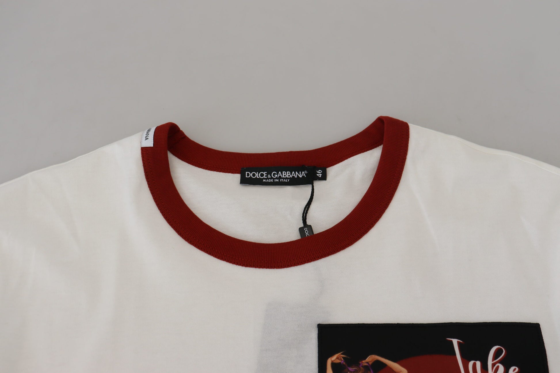 White t-shirt with red collar and pocket on front