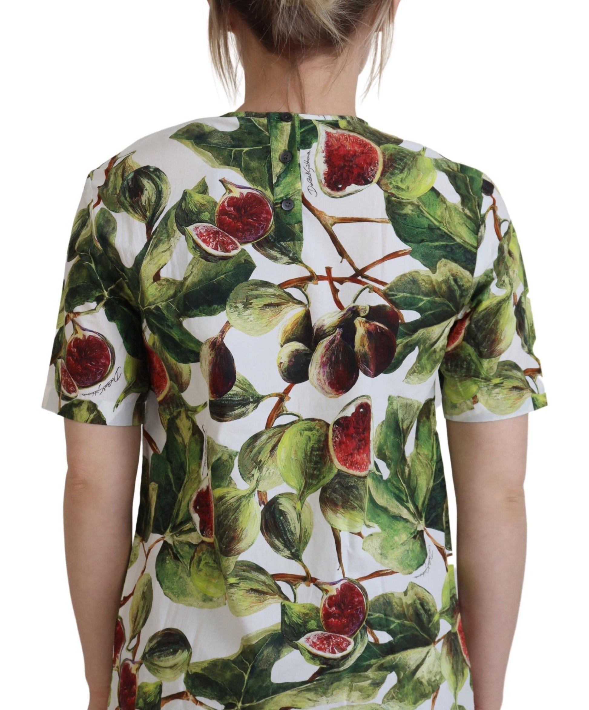 The back of a woman's shirt with a fruit print design