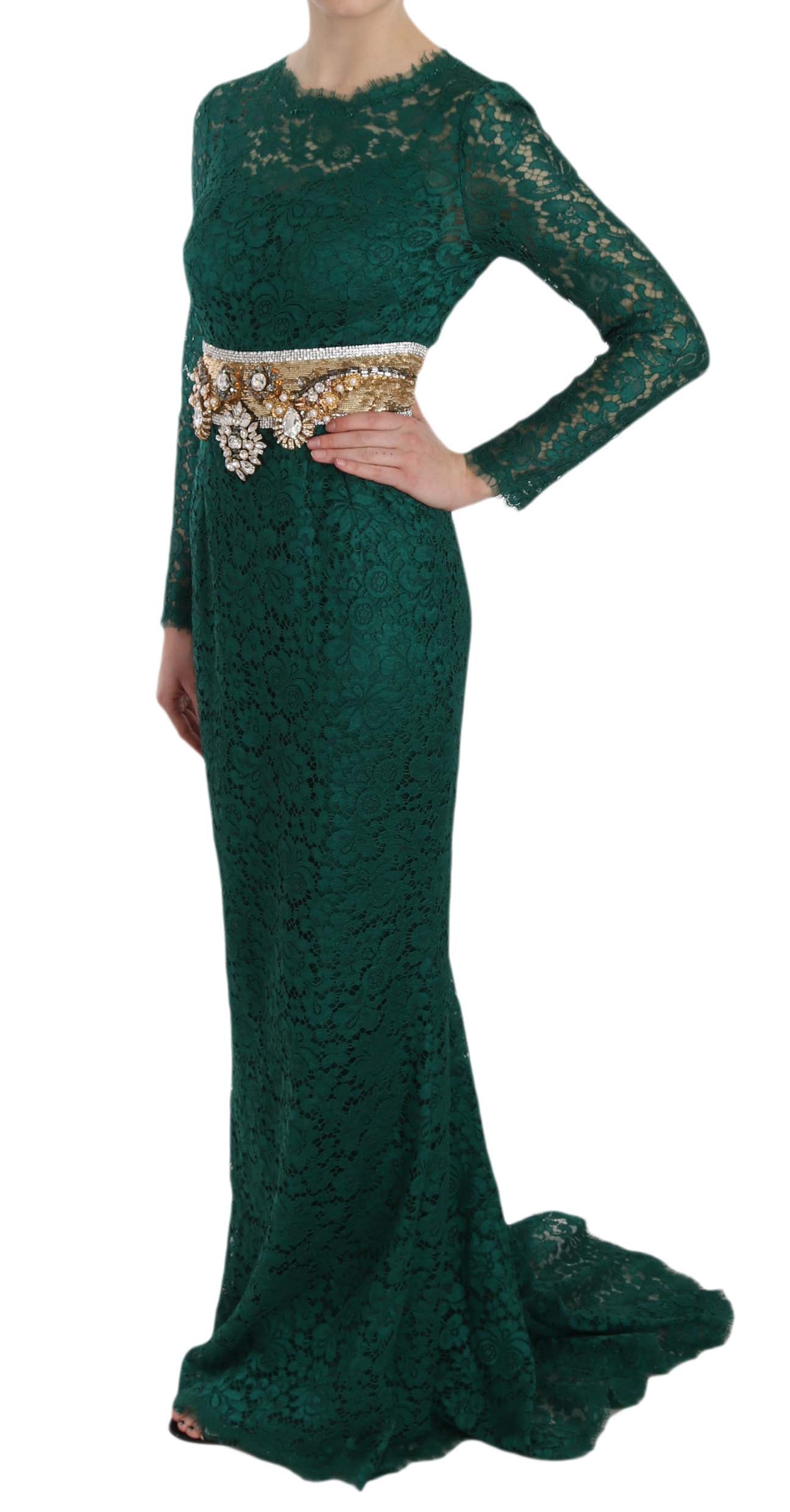 A long green lace dress with a gold belt and crystals, worn by a model