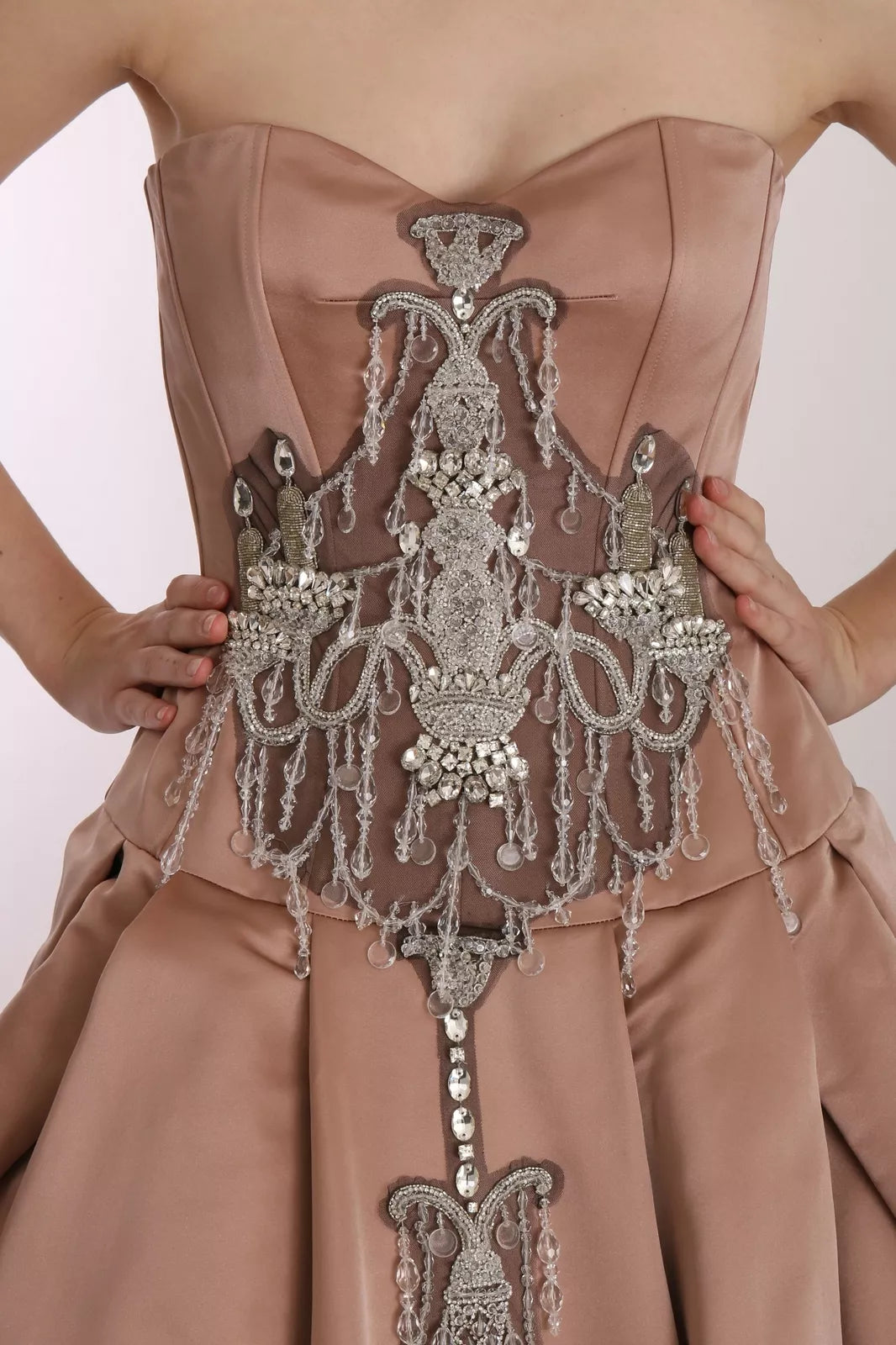 A pink chandelier ball gown dress with crystal embellishments