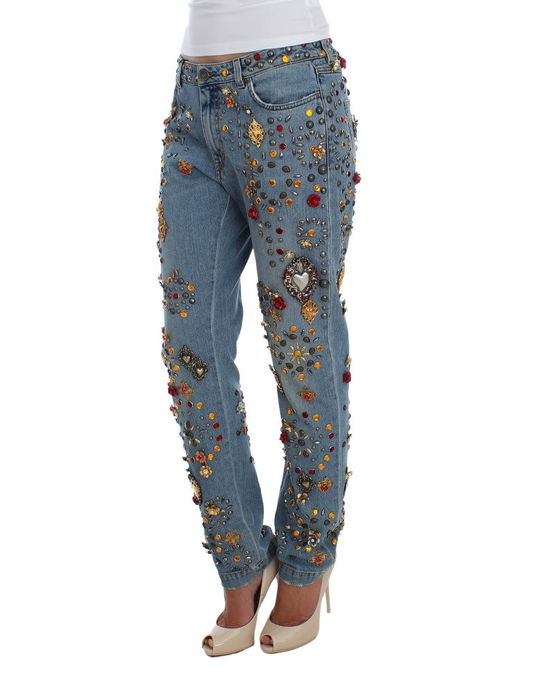 Woman wearing embellished jeans with floral and gemstone designs