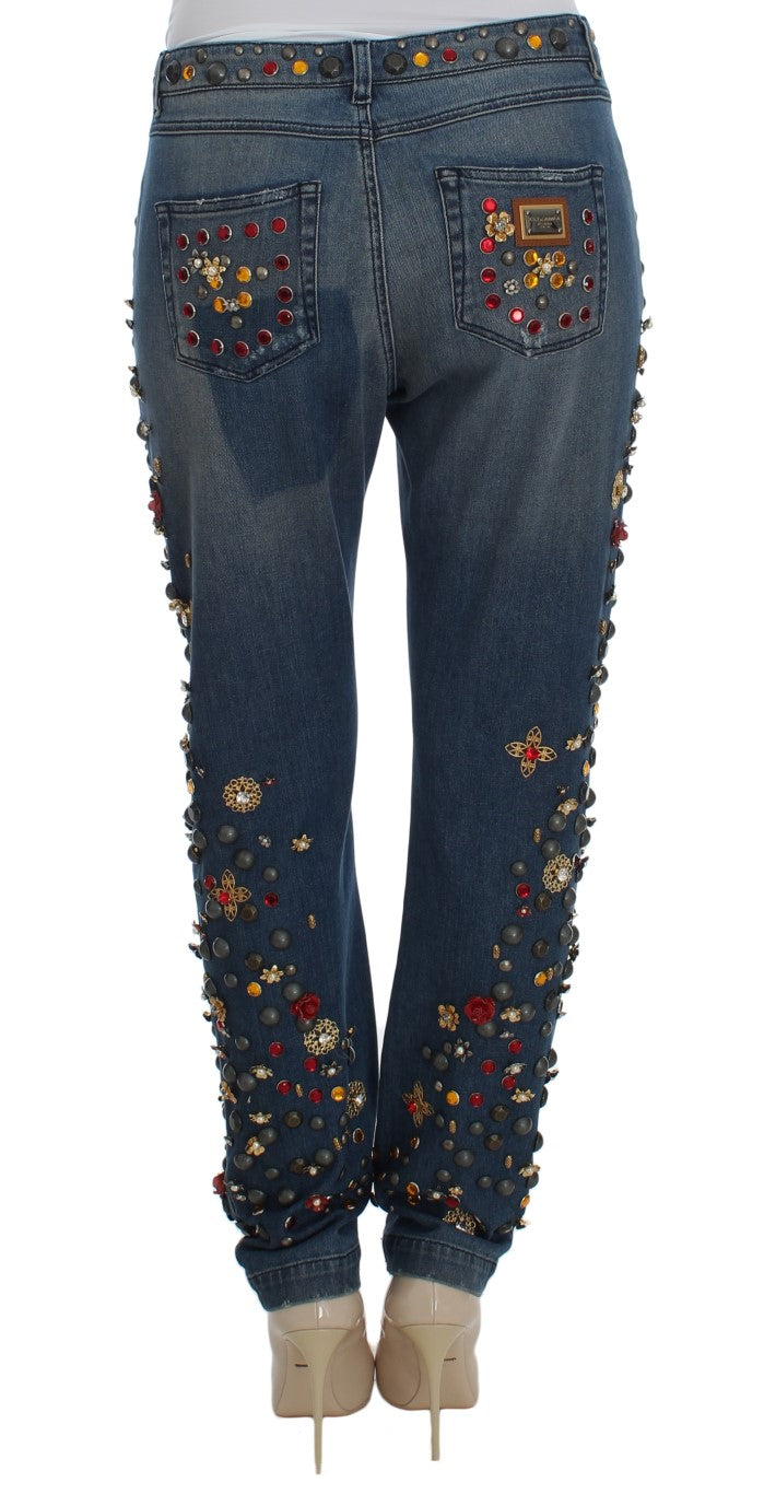 Pair of women's jeans with embroidered floral designs on legs and waistband