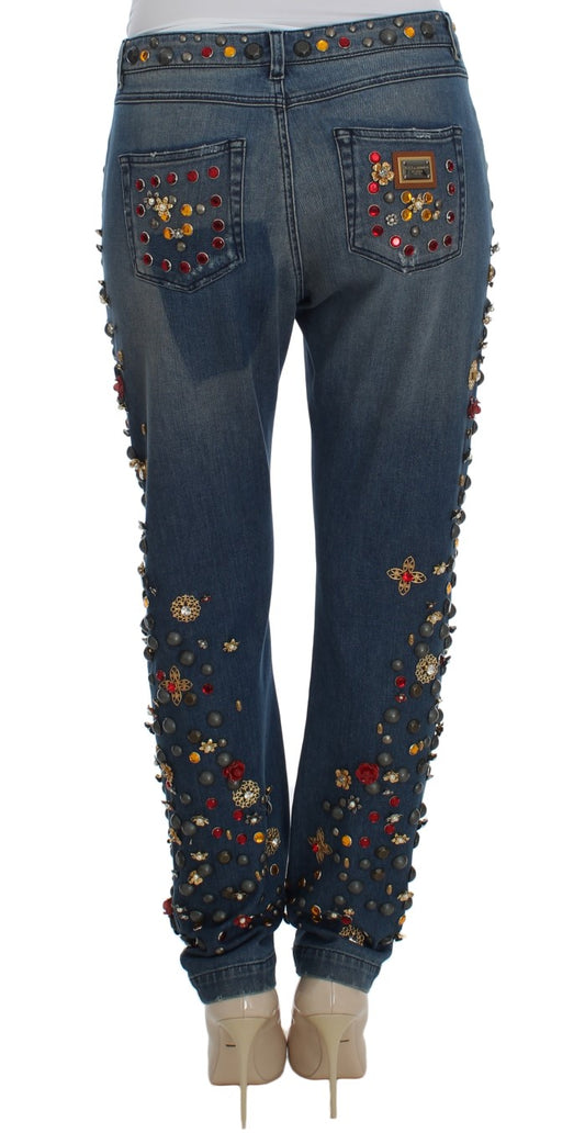 Pair of women's jeans with embroidered floral designs on legs and waistband
