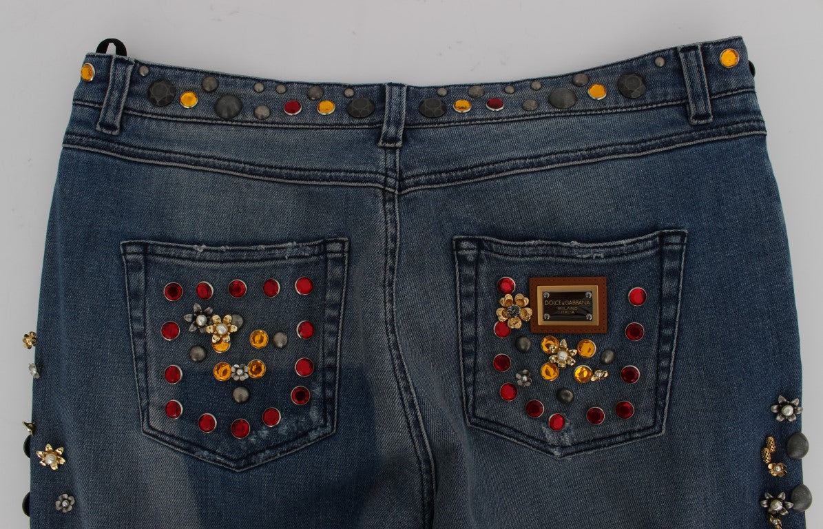 Denim jeans with embellishments on front pockets and back pocket